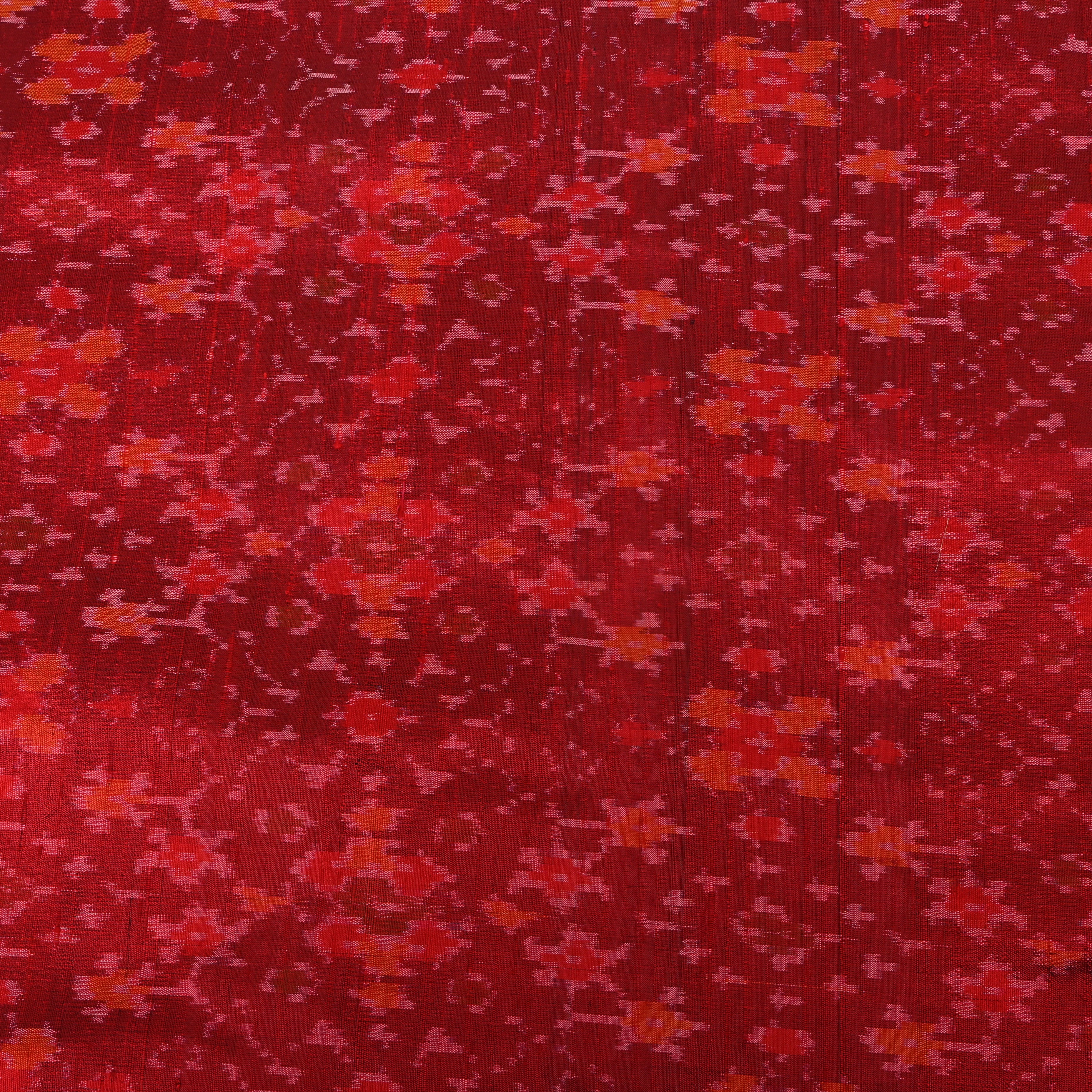 Rich Red Dupion Silk With Dense Ikat Weave Pattern