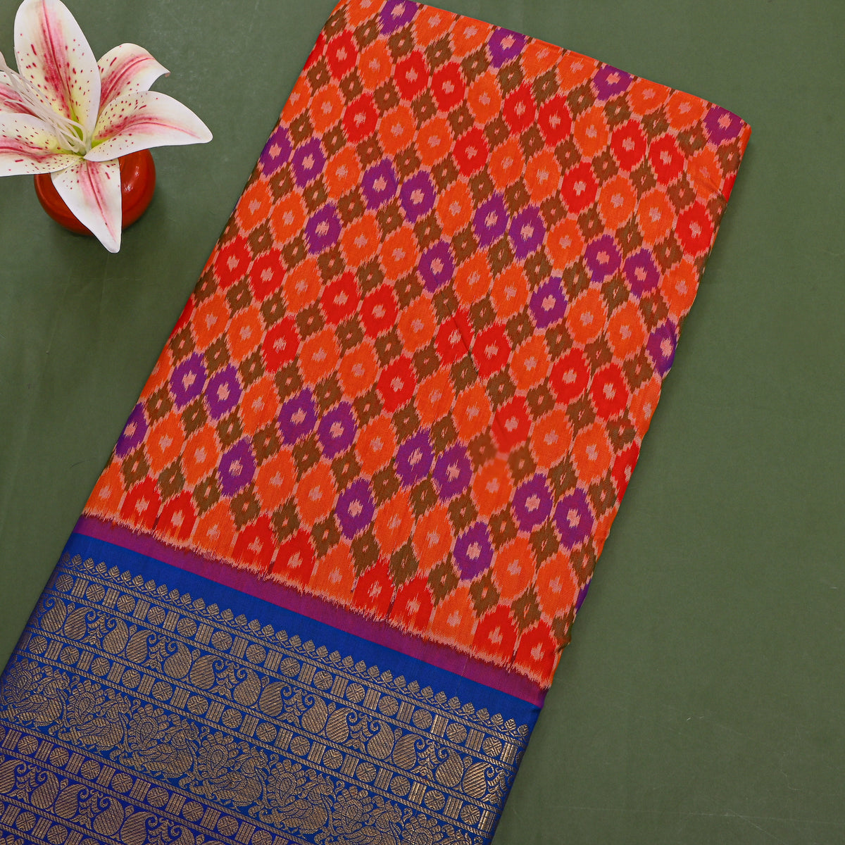 Marigold Ikat Silk Fabric With Blue Gold Zari Border