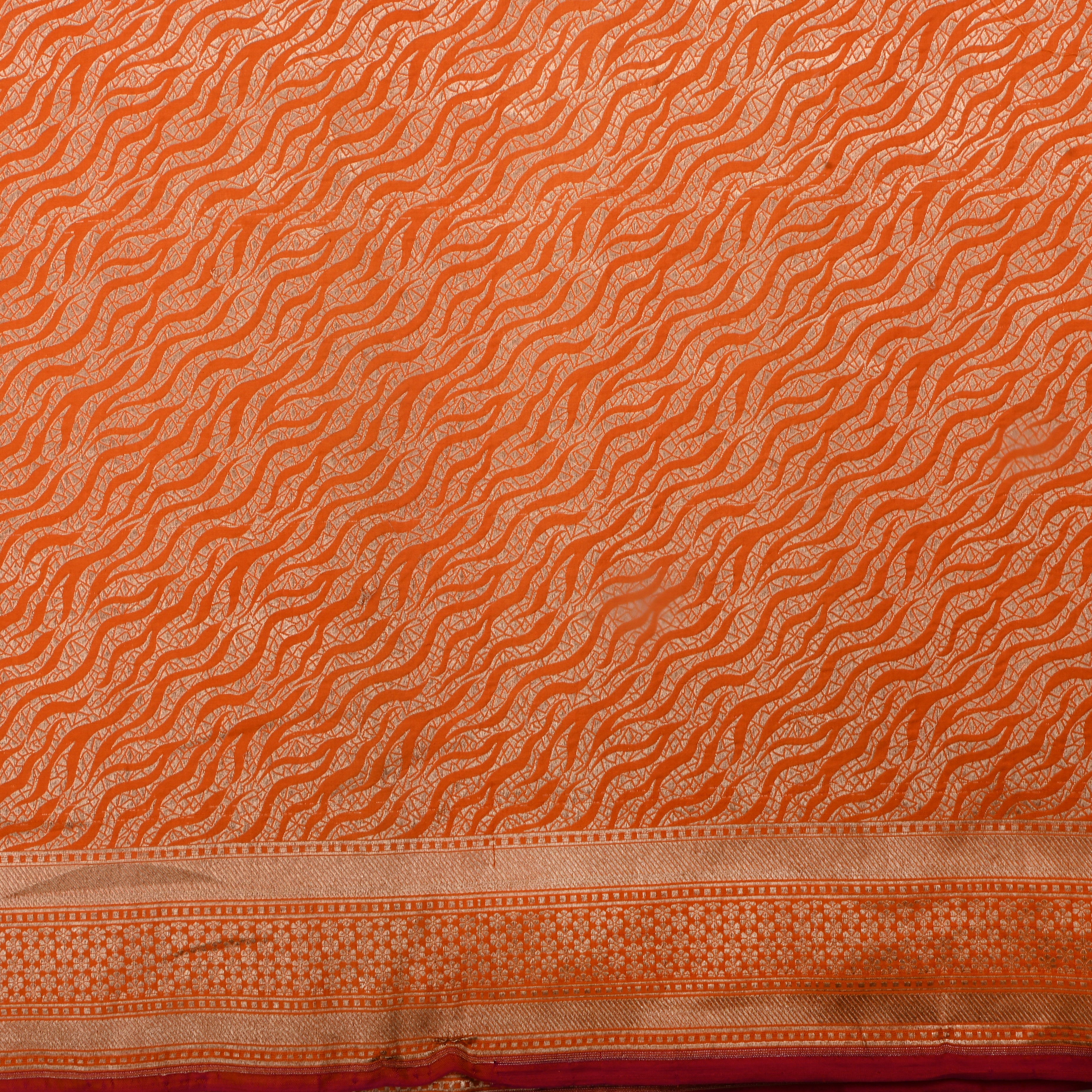 Rusty Orange Jamawar Silk Fabric With Wavy Pattern