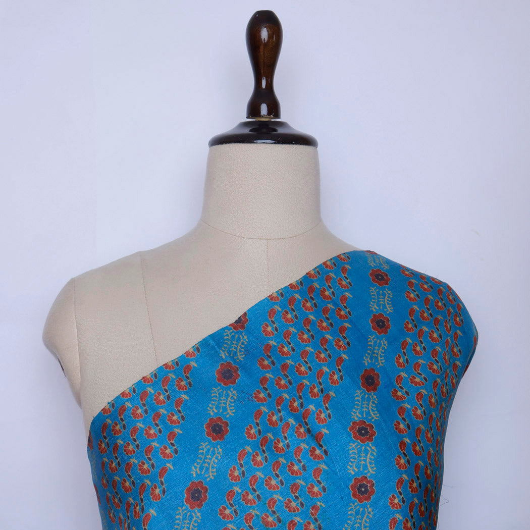 Maya Blue Tussar Fabric With Printed Floral Patterns