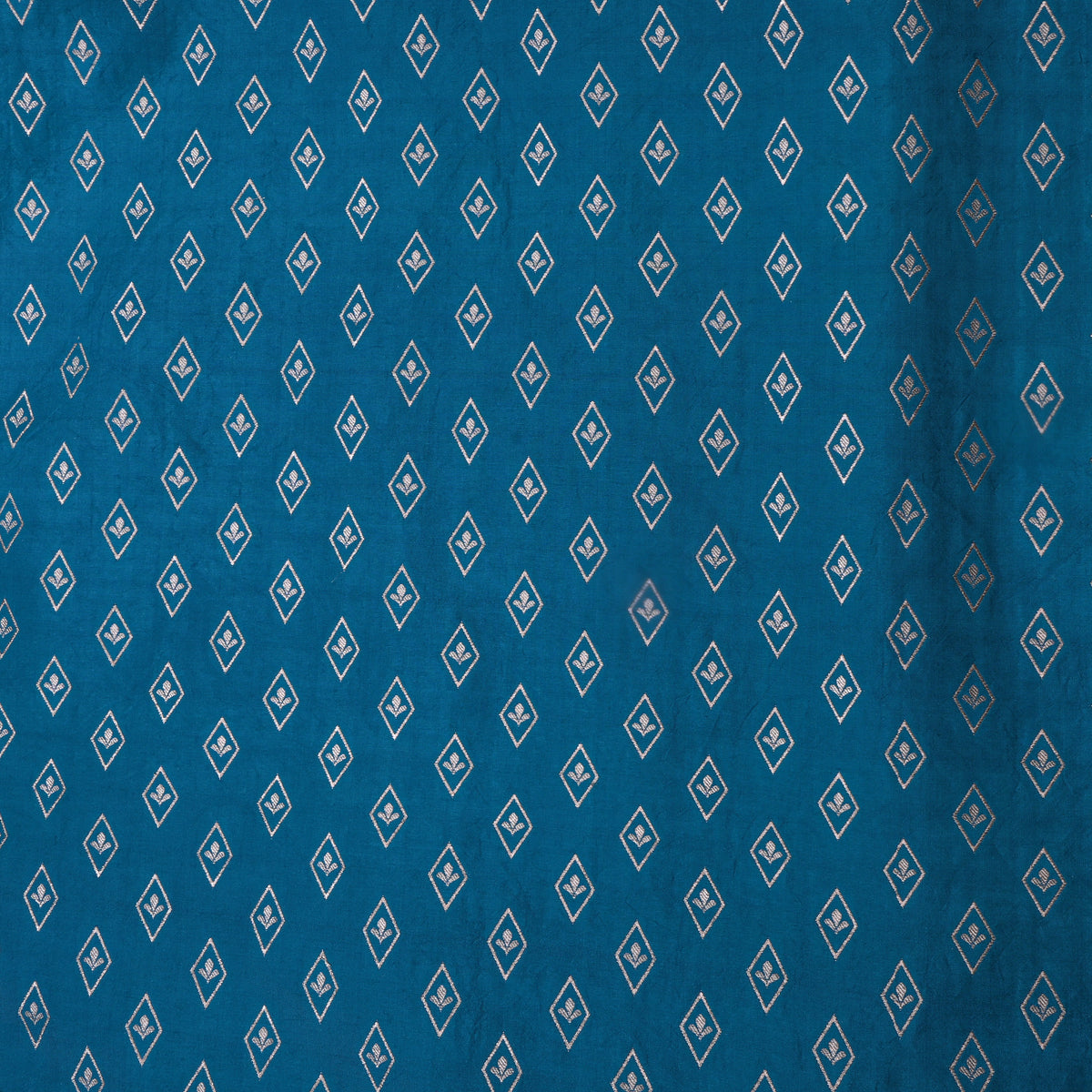 Peacock Teal Banarasi Silk With Silver Zari Butti.