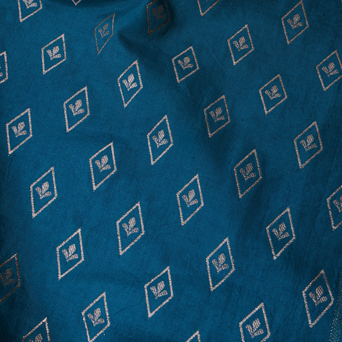 Peacock Teal Banarasi Silk With Silver Zari Butti.