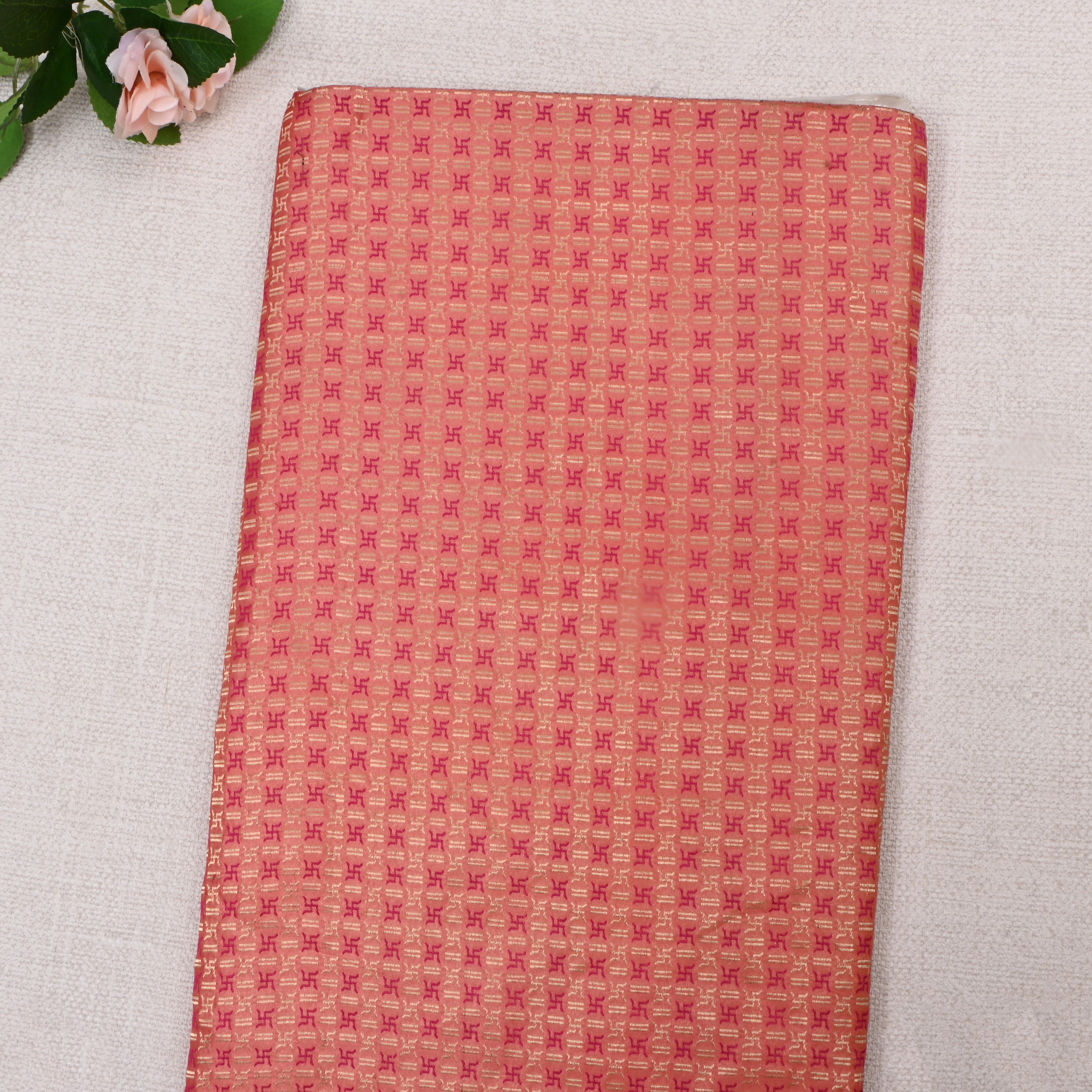 Peach Jamawar Satin Fabric With Swastika Symbols