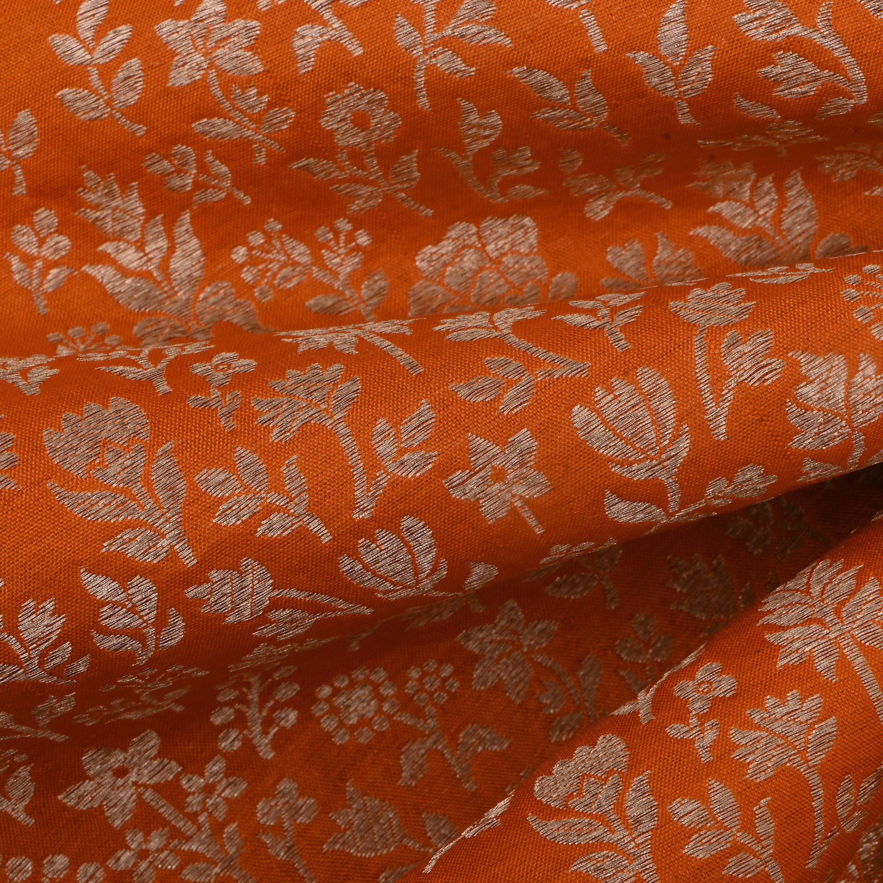 Bright Orange Jamawar Silk Fabric With Floral And Leaf Design