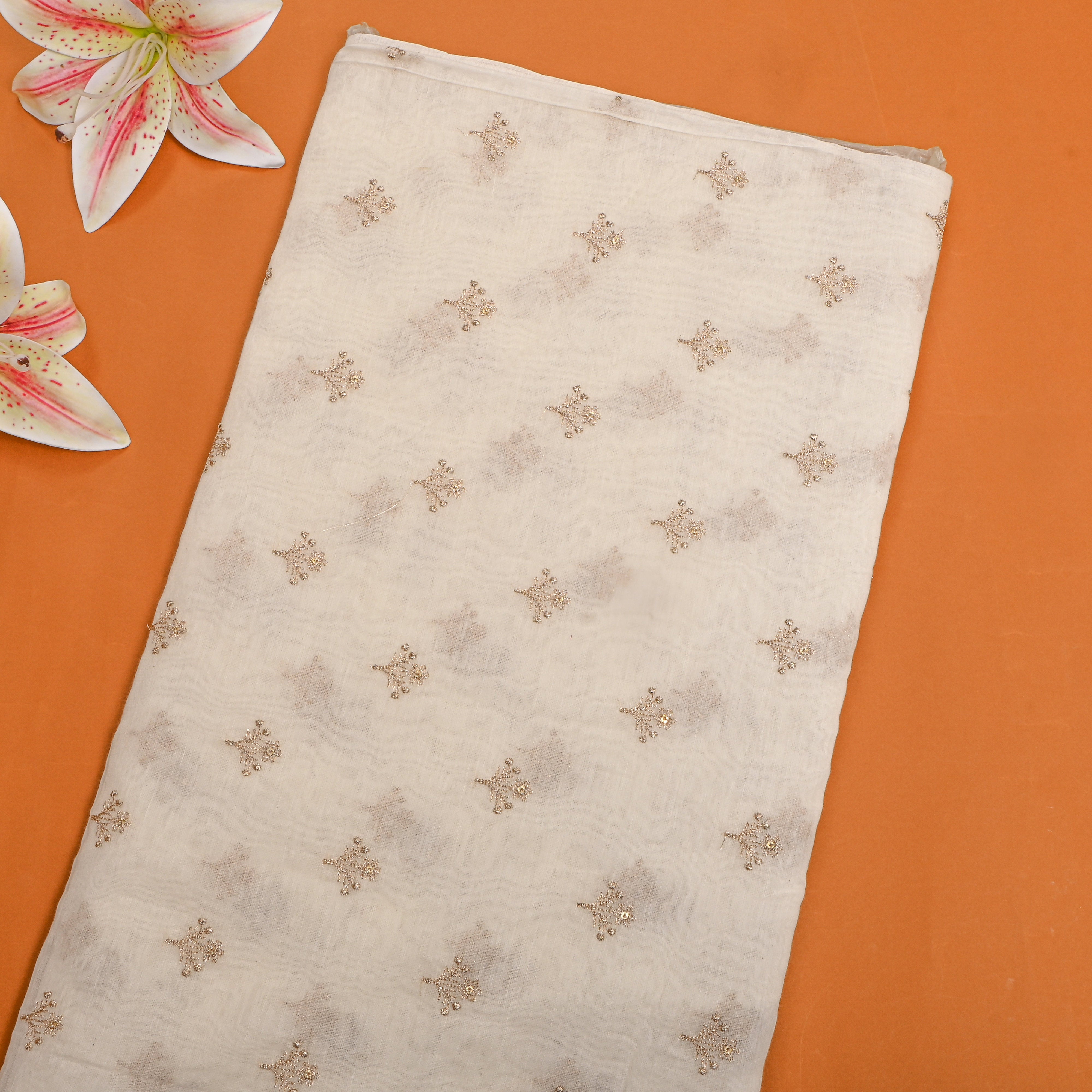 White Chanderi Fabric With Scattered Gold Buttis