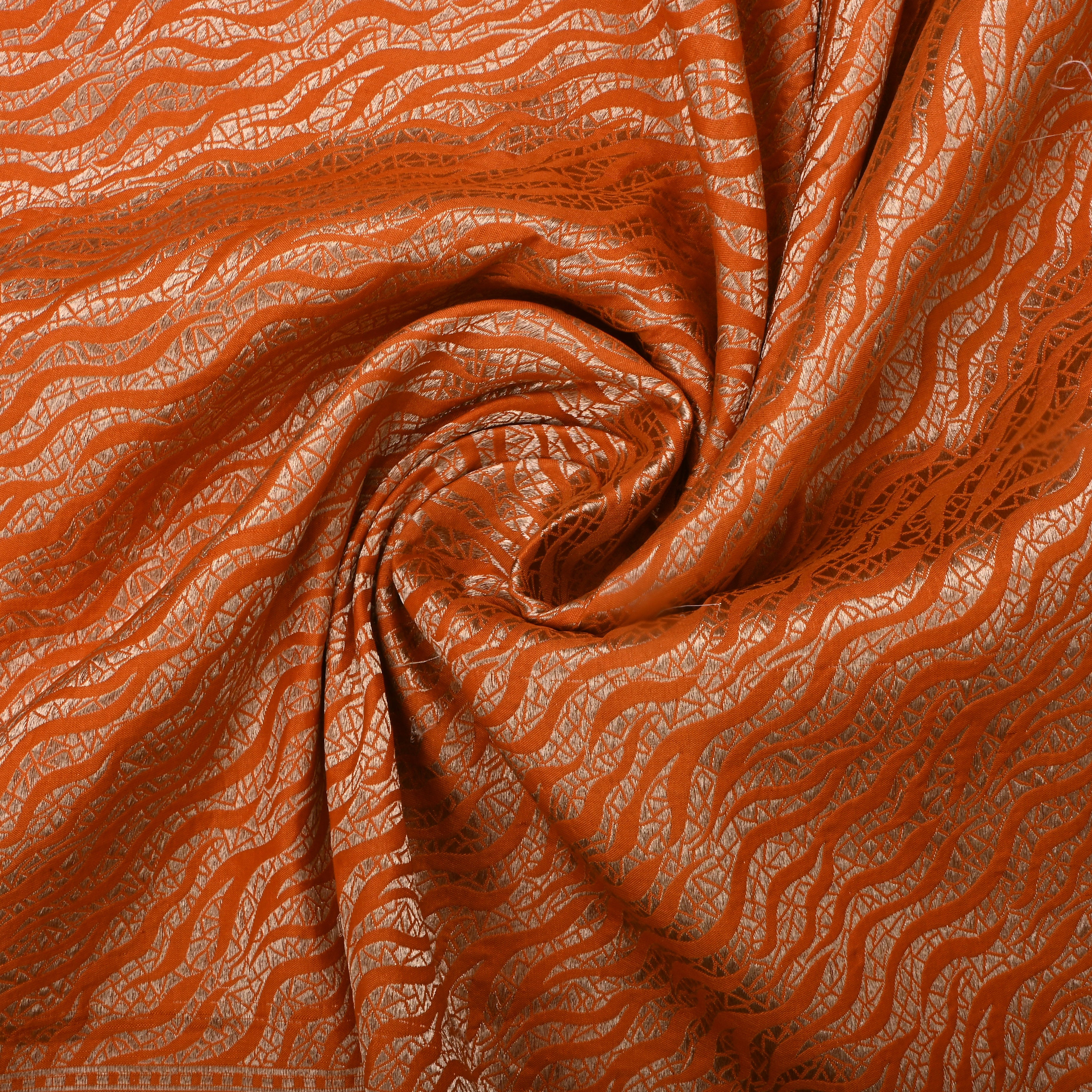 Rusty Orange Jamawar Silk Fabric With Wavy Pattern