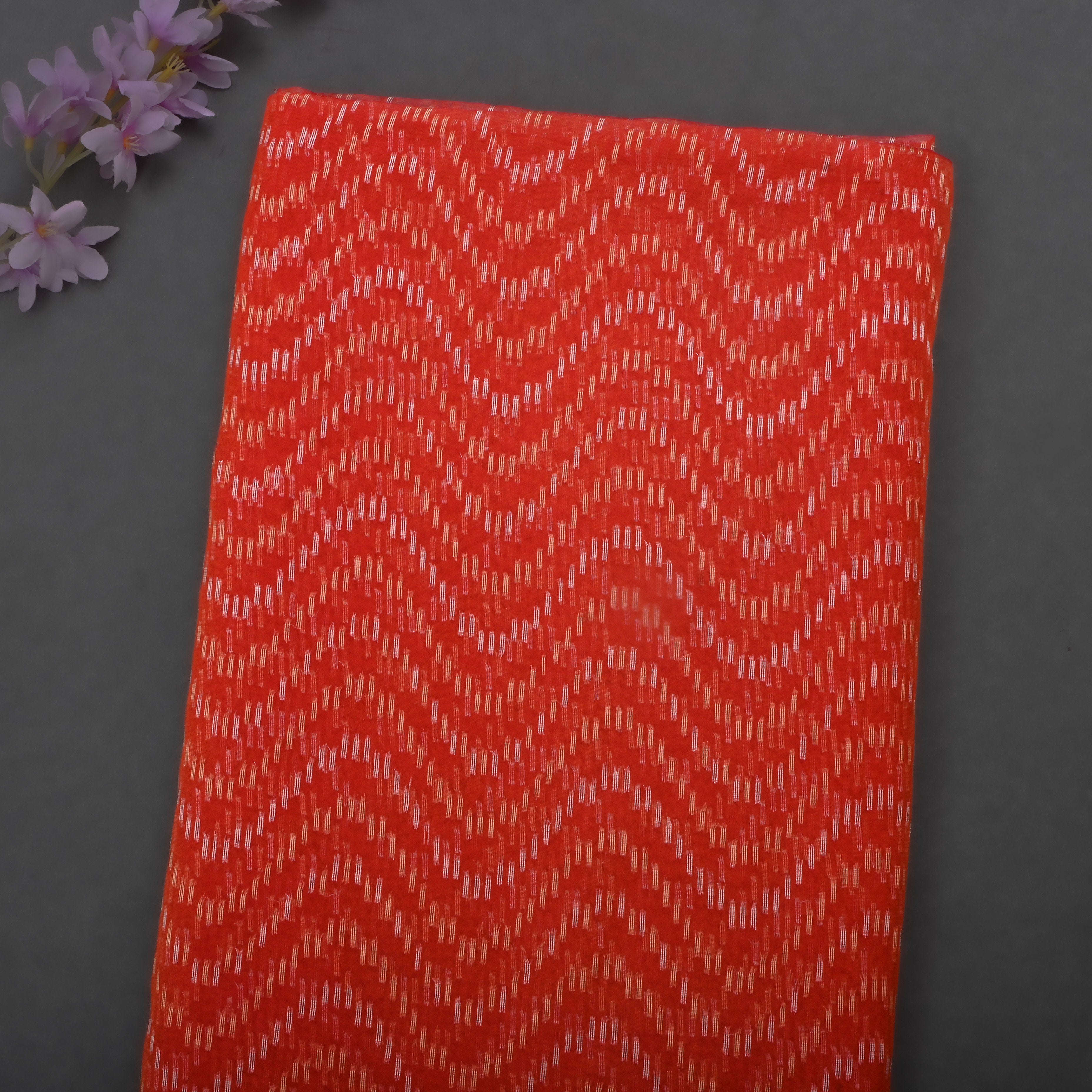 Thunderbird Orangy Red Jamawar Organza Fabric With Contrast Border