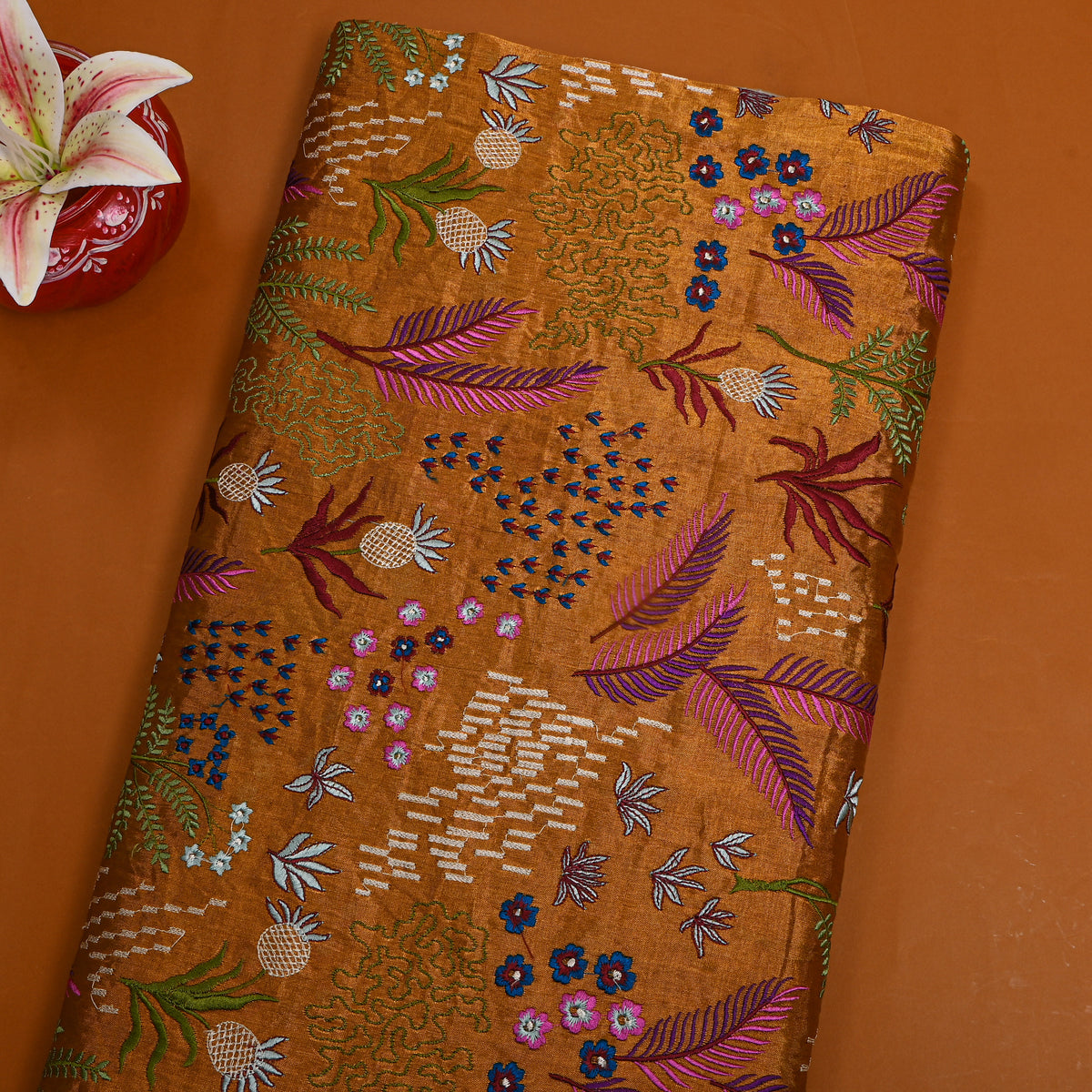 A Dark Rust Orange With Colourful Floral Thread Work Thissue Fabric