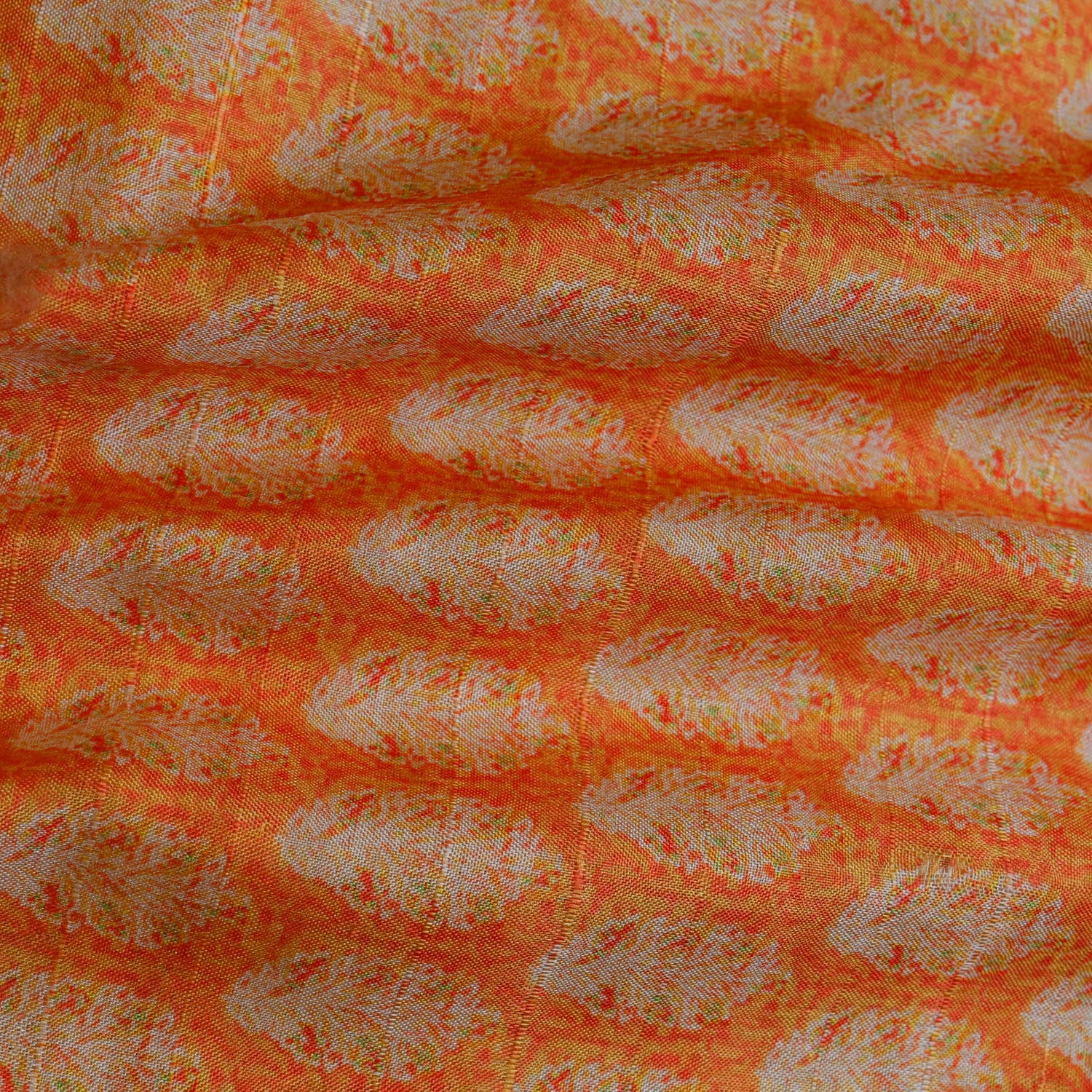 Fire Orange Color Tussar Fabric With Leafs Pattern