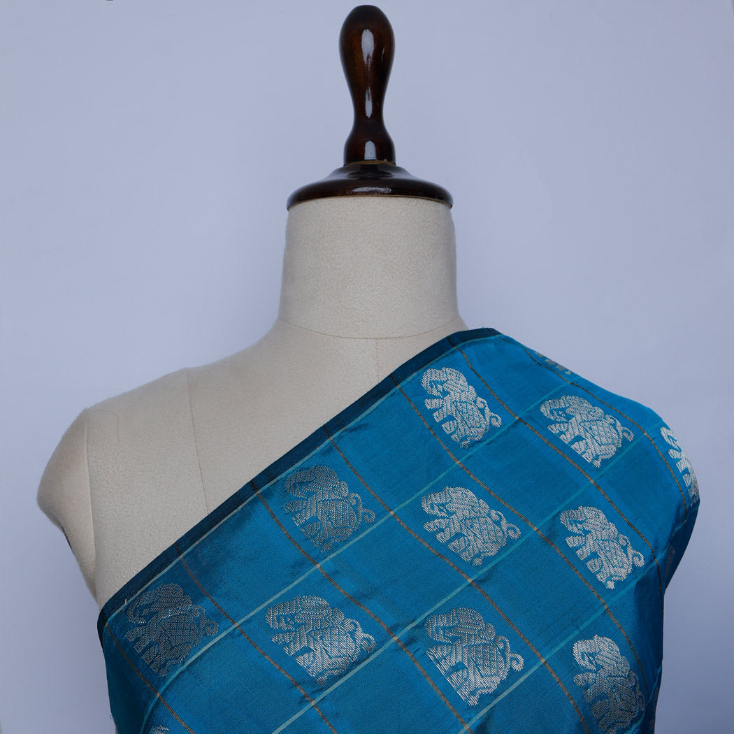 Azure Blue Color Silk Fabric With Yanai Motifs In Checks Pattern