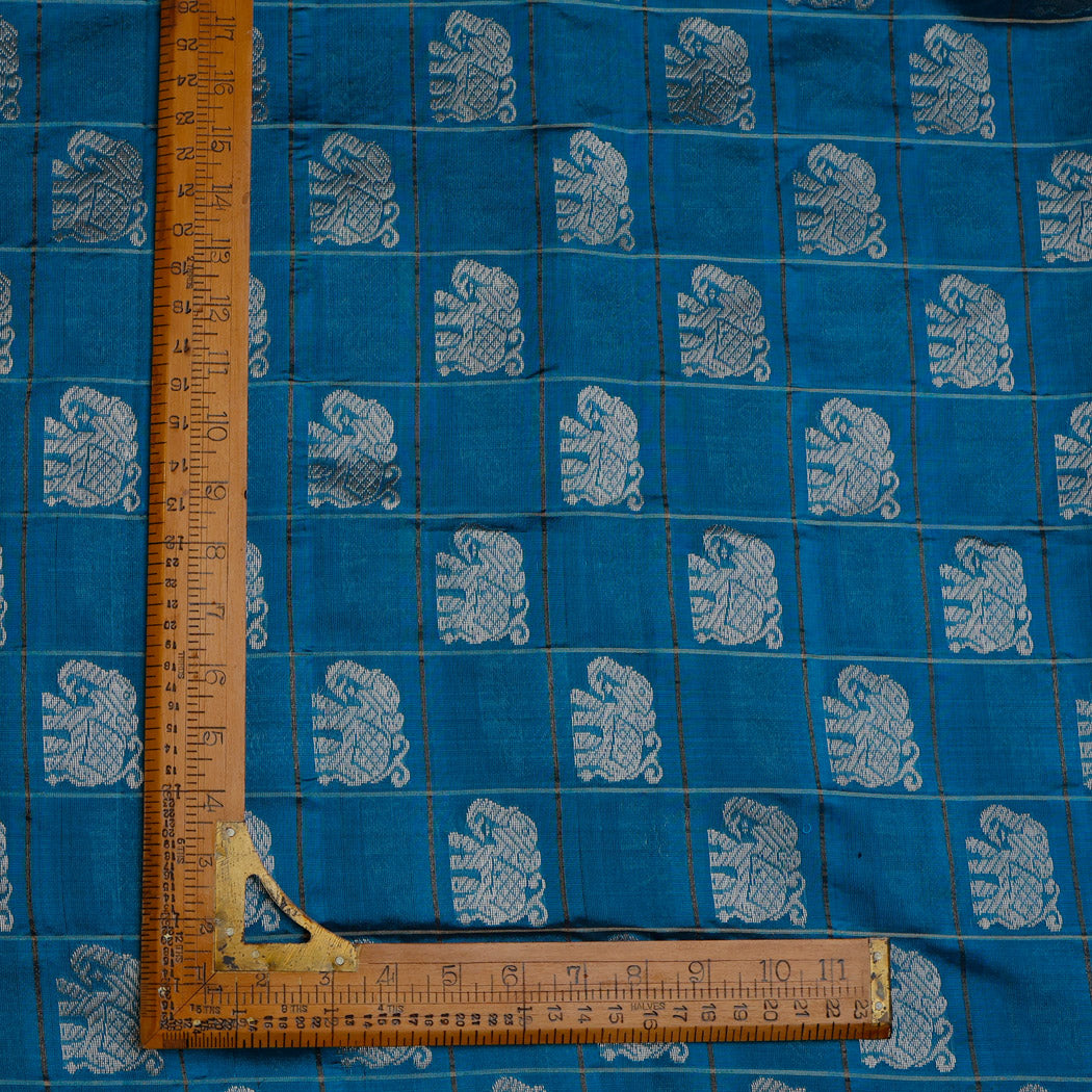 Azure Blue Color Silk Fabric With Yanai Motifs In Checks Pattern