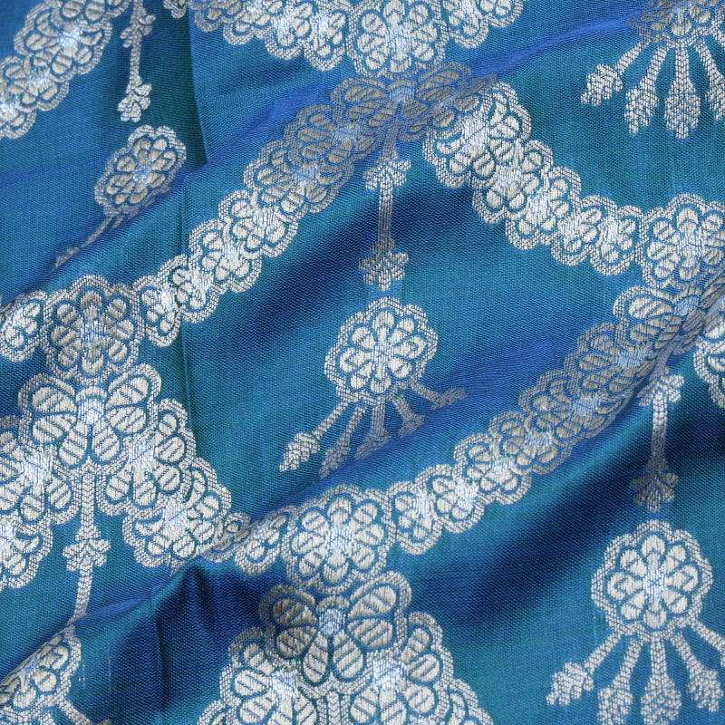 Prussian Blue Color Jamavar Silk Fabric With Scallop Floral Pattern