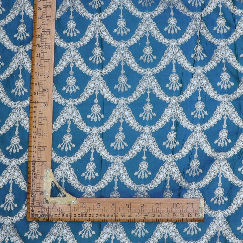 Prussian Blue Color Jamavar Silk Fabric With Scallop Floral Pattern