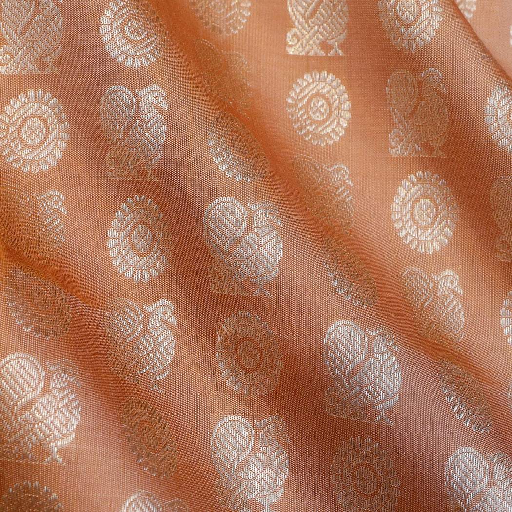 Pale Orange Color Silk Fabric With Floral And Mayil Buttis