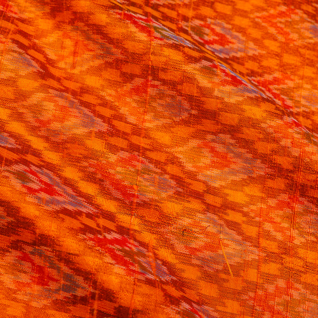 Bright Orange Color Dupion Silk Fabric With Ikat Design