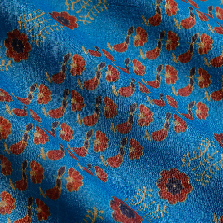 Maya Blue Color Tussar Fabric With Floral Booties Pattern