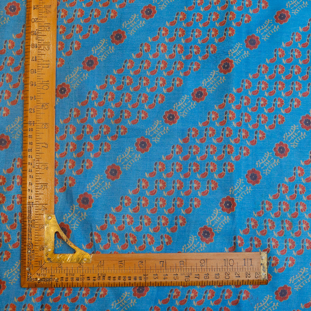 Maya Blue Color Tussar Fabric With Floral Booties Pattern