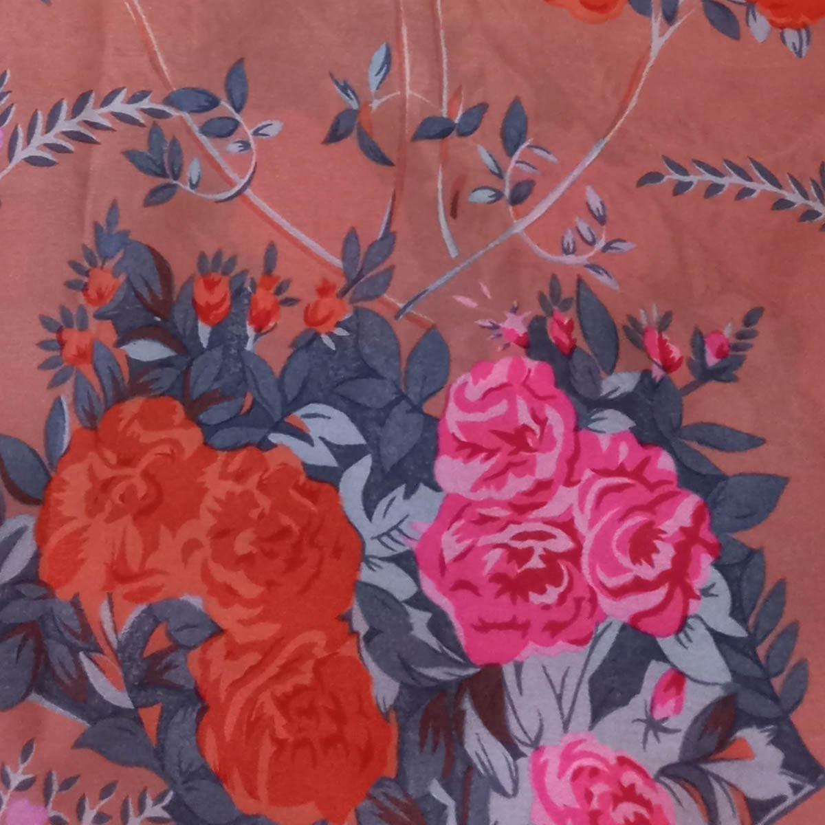 Coral Orange Color Silk Fabric With Printed Floral Motifs